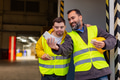 Man with Down syndrome and his colleague taking break from work, taking selfie on smartphone, having - PhotoDune Item for Sale