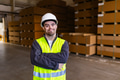 Portrait of young man with Down syndrome working in factory, warehouse. Concept of workers with - PhotoDune Item for Sale