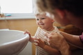 Father brushing little baby boy's teeth in the morning. Morning dental hygiene for toddlers. - PhotoDune Item for Sale