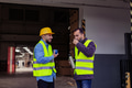 Portrait of two workers taking break from work, drinking coffee, talking and resting, standing on - PhotoDune Item for Sale