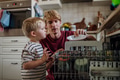 Little boy helping father to load dishwasher after breakfast. Cleaning the kitchen before leaving to - PhotoDune Item for Sale