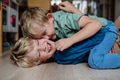 Two little boys fighting on the floor, brothers having fun at home. Concept of sibling relationship - PhotoDune Item for Sale