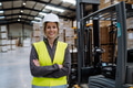 Female warehouse worker standing by forklift. Warehouse manager checking delivery, stock in - PhotoDune Item for Sale