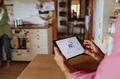 Man using smart thermostat, adjusting, lowering heating temperature at home. Concept of sustainable - PhotoDune Item for Sale