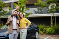Happy young family with little son waiting for charging their electric car. - PhotoDune Item for Sale