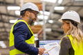 Female engineer and male project manager standing in modern industrial factory, talking about - PhotoDune Item for Sale