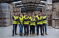 Full team of warehouse employees standing in warehouse. Team of workers, managers, female director - PhotoDune Item for Sale