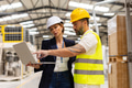 Female manager talking with foreman, checking production plan on notebook. Woman quality controller - PhotoDune Item for Sale