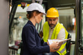 Forklift driver talking with manager in modern industrial factory. Warehouseman reading order, order - PhotoDune Item for Sale