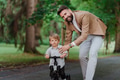 Single father with his little son spending together time in public park. - PhotoDune Item for Sale