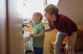 Father helping brush boy's teeth in the morning. Morning dental hygiene for toddlers. - PhotoDune Item for Sale