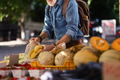Senior man shopping at market in the city. Elderly man buying fresh vegetables and fruits from - PhotoDune Item for Sale