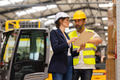 Forklift driver talking with manager in modern industrial factory. Warehouseman reading order, order - PhotoDune Item for Sale