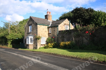 Beautiful view of a traditional English cottage house in the UK