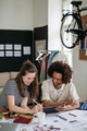 Young colleagues working together in startup company. - PhotoDune Item for Sale