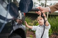 Close up of man and his little son charging their electric car. - PhotoDune Item for Sale