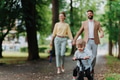 Young family with little son on walk after work. - PhotoDune Item for Sale