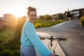 Young woman on electro bicycle, concept of commuting and ecologic traveling. - PhotoDune Item for Sale