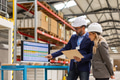 Female engineer and male project manager standing in modern industrial factory, talking about - PhotoDune Item for Sale