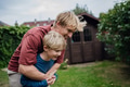 Father embracing his young son, having bonding moment. Concept of Father's Day, and fatherly love. - PhotoDune Item for Sale