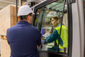 Female forklift driver talking with manager in warehouse, order picking. Warehouse worker preparing - PhotoDune Item for Sale