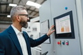 Production manager standing in modern industrial factory, controlling production process - PhotoDune Item for Sale
