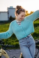Young woman on electro bicycle, concept of commuting and ecologic traveling. - PhotoDune Item for Sale