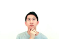 Portrait of Handsome Asian man thinking and looking up on isolated white background - PhotoDune Item for Sale