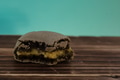 Colorful macarons in blue turquoise pastel isolated background on wood table - PhotoDune Item for Sale