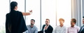 Woman talking to businessmen in office - PhotoDune Item for Sale