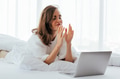 Woman on bed near laptop - PhotoDune Item for Sale