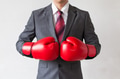 Businessman in boxing gloves on white background - PhotoDune Item for Sale