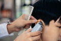 Hands of barber using razor to trim hair - PhotoDune Item for Sale