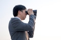 Businessman looking for something with binoculars - PhotoDune Item for Sale