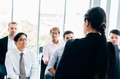 Female leader doing presentation for coworkers - PhotoDune Item for Sale