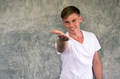 Young man with happy and friendly smile pointing finger at camera - PhotoDune Item for Sale