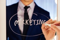 Smart business man writing the word Marketing on the mirror board - PhotoDune Item for Sale