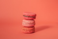 Pile of red-toned macaroons stacked up like a tower in red pastel isolated background - PhotoDune Item for Sale