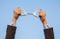 Business man showing handcuffs after releasing it. - PhotoDune Item for Sale