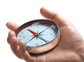 Hand holding a compass over white background. Strategic orientation or direction concept. - PhotoDune Item for Sale