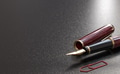 Fountain pen over black background with copy space. - PhotoDune Item for Sale