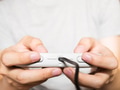 A young man holding game controller playing video games - PhotoDune Item for Sale