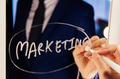 Smart business man writing the word Marketing on the mirror board - PhotoDune Item for Sale