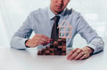 businessman taking a toy car driving up towards the stairs of achievement with house on the top - PhotoDune Item for Sale