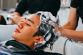 Barber washing head client in barbershop - PhotoDune Item for Sale