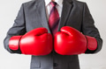Businessman in boxing gloves on white background - PhotoDune Item for Sale