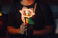 Buddhist praying with incense sticks, lotus flower and candles on holy religion - PhotoDune Item for Sale
