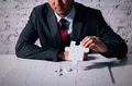 Young Businessman in suit holding the last missing piece of jigsaw - PhotoDune Item for Sale