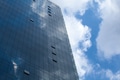 Abstract glass building reflecting clouds and blue sky - PhotoDune Item for Sale