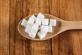Sugar Cubes on Wooden Spoon over Wooden Background - PhotoDune Item for Sale